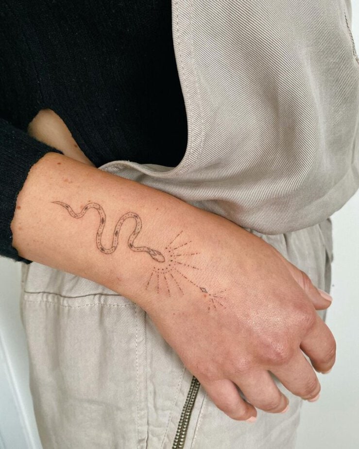 A snake tattoo on the wrist