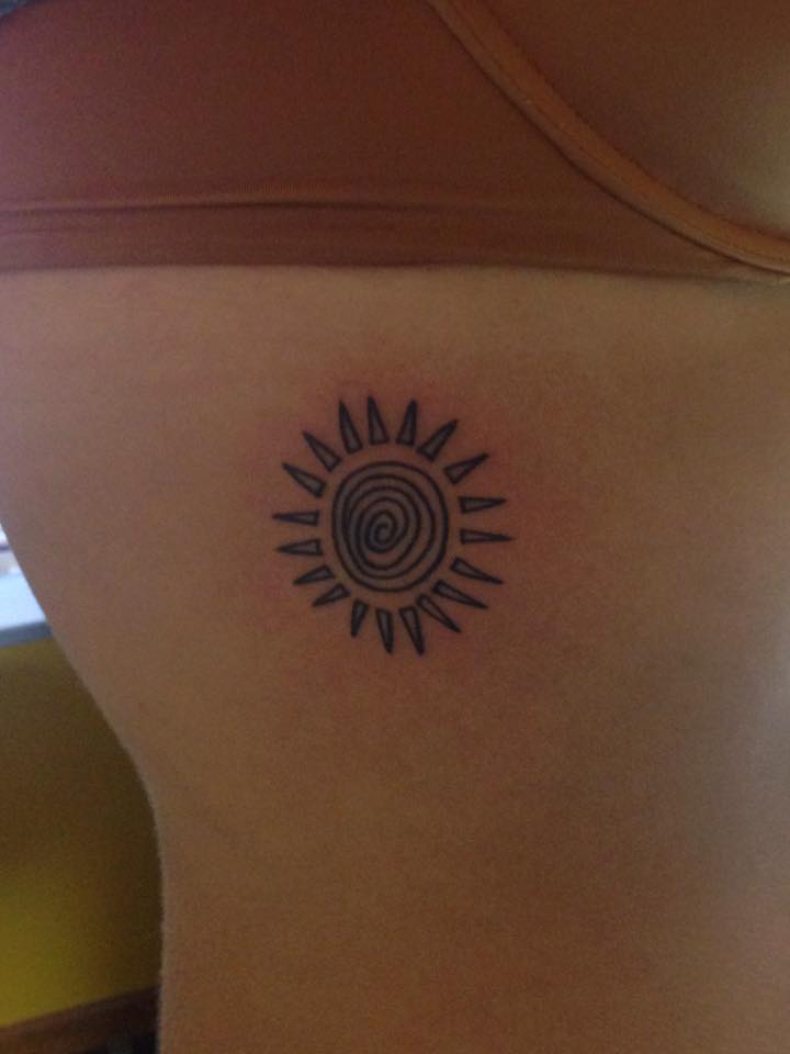 Charming Tiny Spiral Sun Rib Tattoo