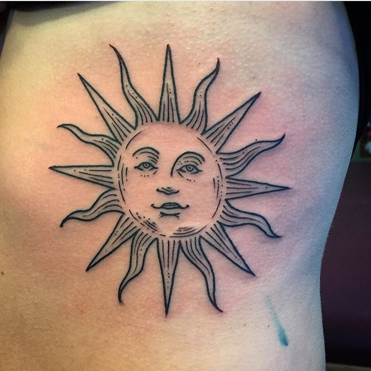 A simple tattoo of the sun