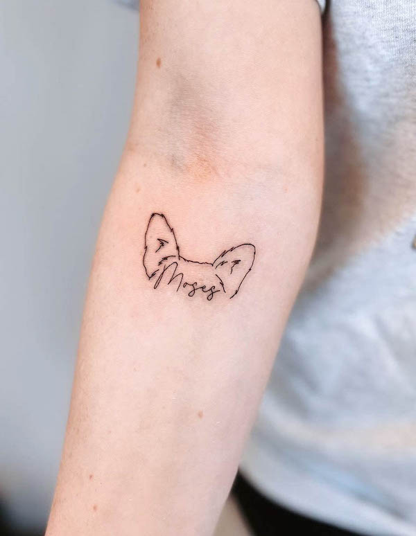 Dog ears and name tattoo