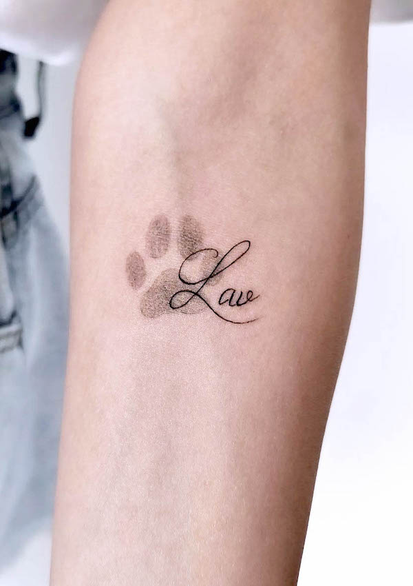 Dog paw prints tattoo