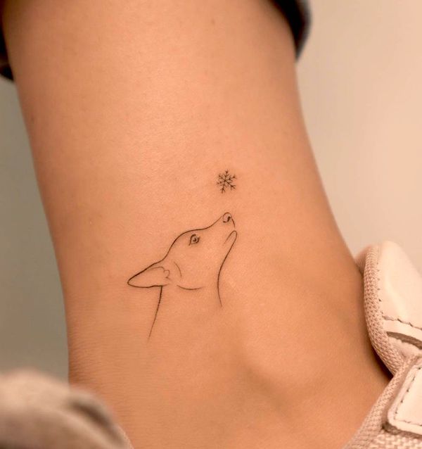 Simple dog and snowflake tattoo