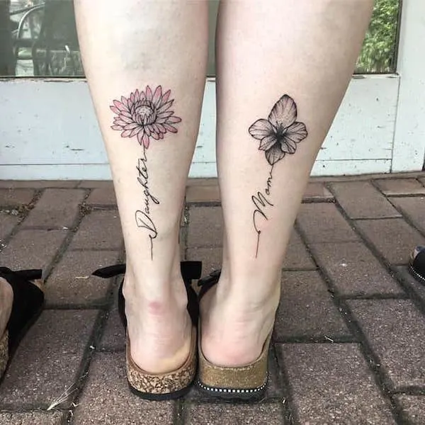 Chrysanthemum and gladioli leg tattoos