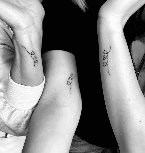 Small hearts mother daughter tattoos