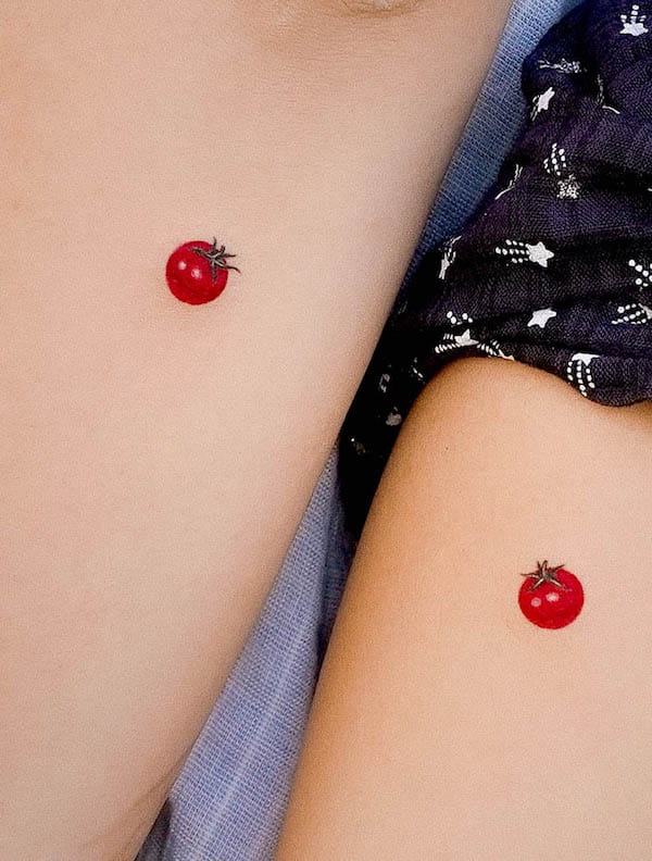 Tiny tomato matching tattoos for mother and daughter