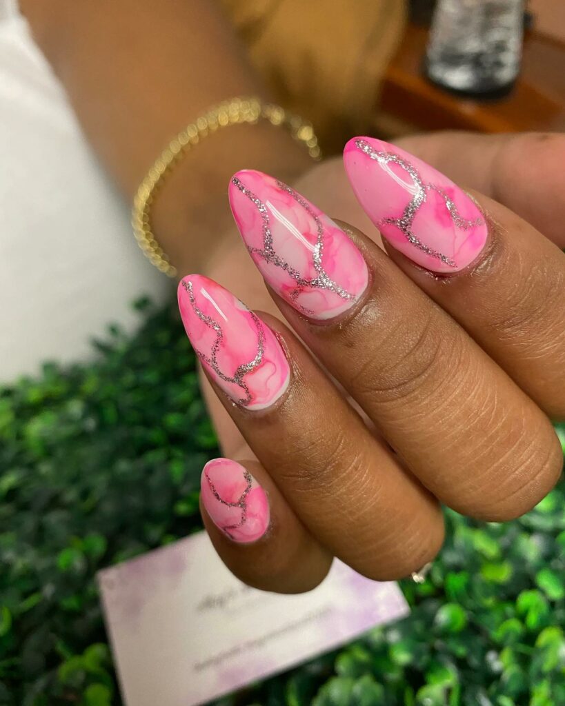 Pink Marble Nails with Glitter Accents