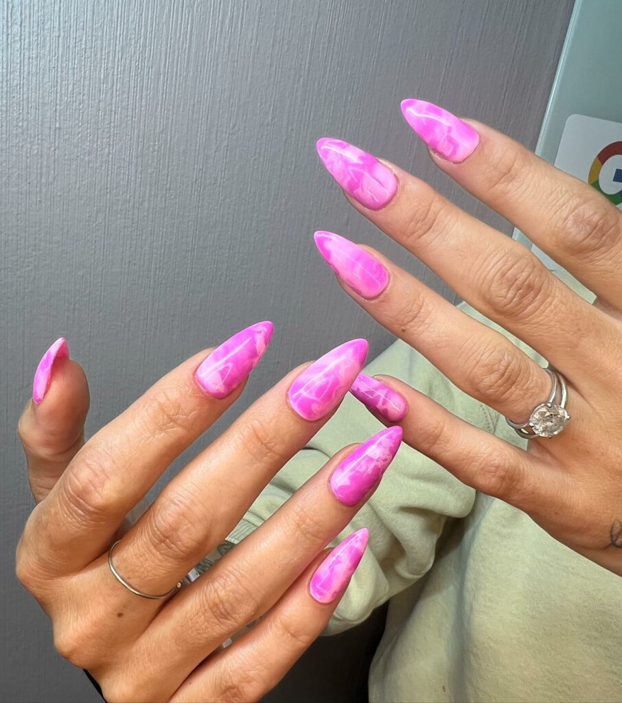 Vivid Pink Marble Nails for a Glam Look