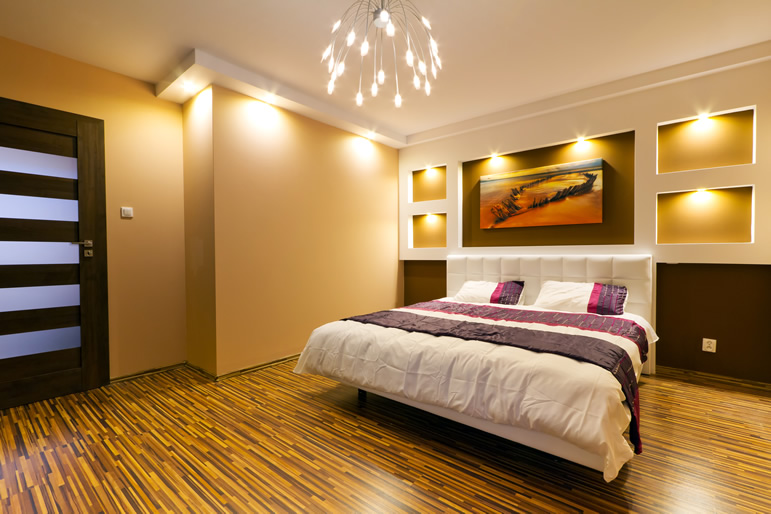 Contemporary Bedroom with Sleek Lighting and Warm Tones