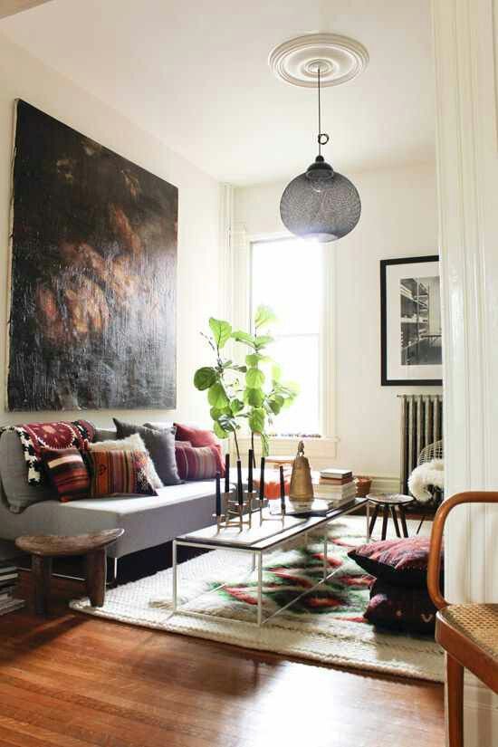 Eclectic and Cozy Living Room with Bold Art and Comfort