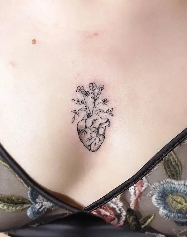 Anatomical heart middle chest tattoo