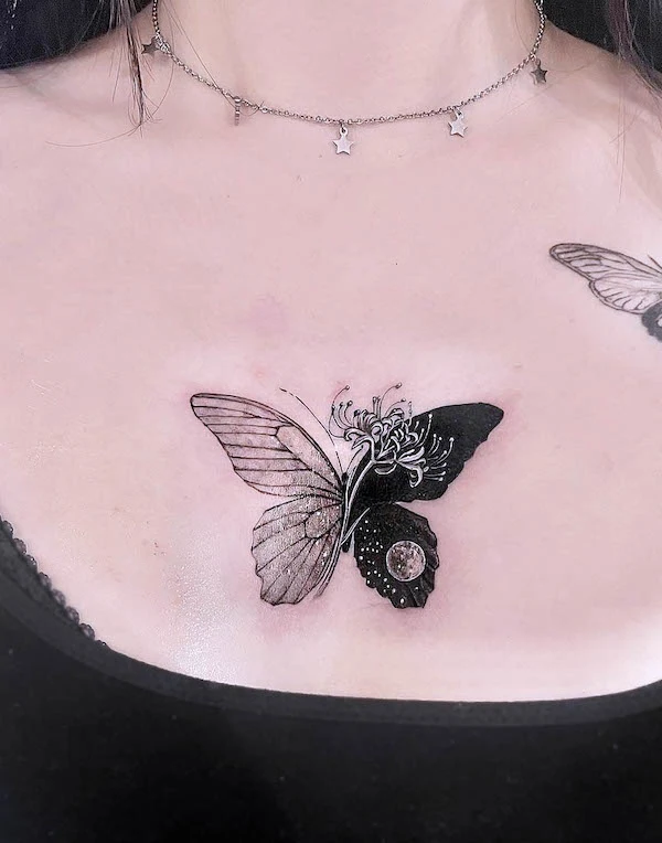 Black and white butterfly chest tattoo