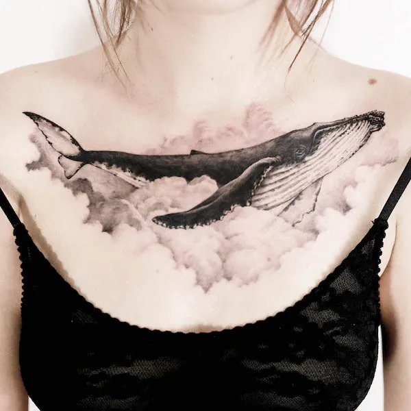 Dreamy whale chest tattoo