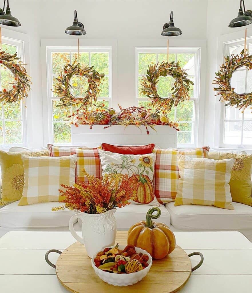 Four Colorful Wreaths Hanging in Bay Windows