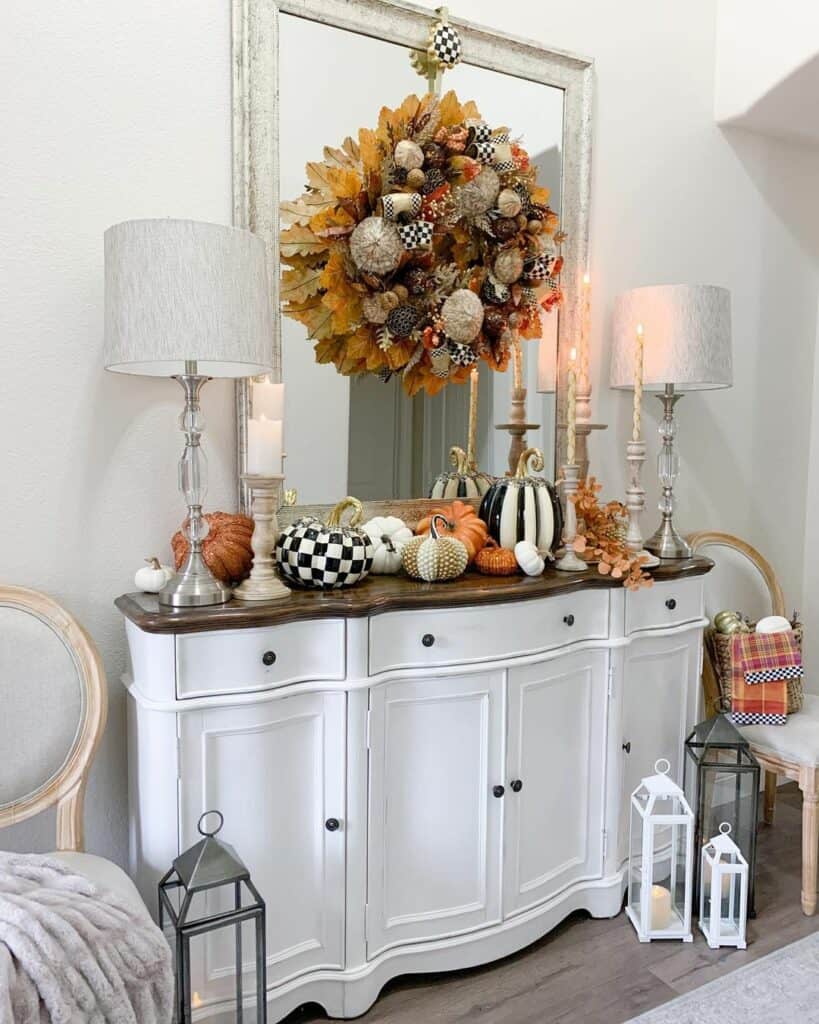 Statement Orange Wreath Above White Sideboard