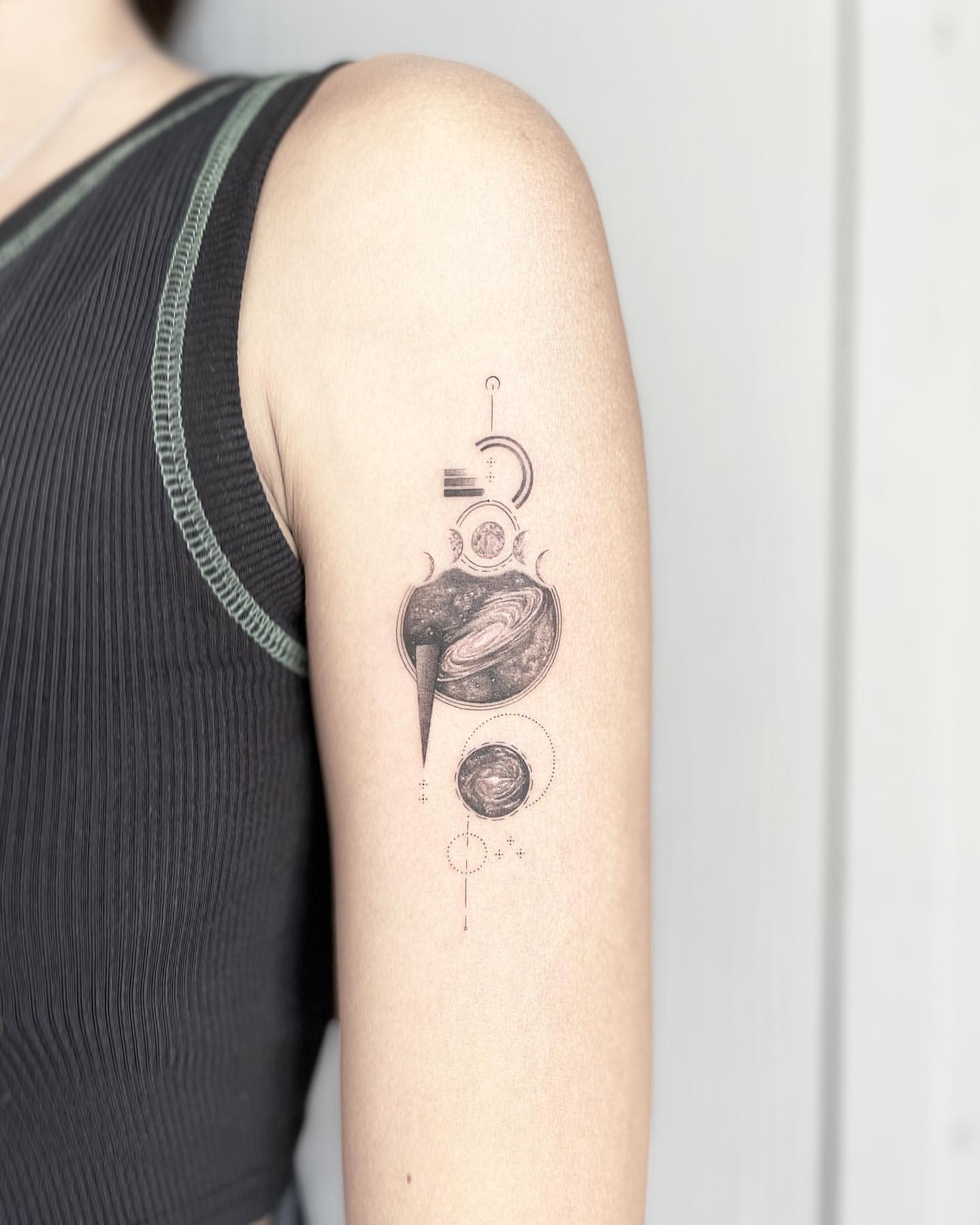 Black and Gray Geometric Arm Tattoo of Planets