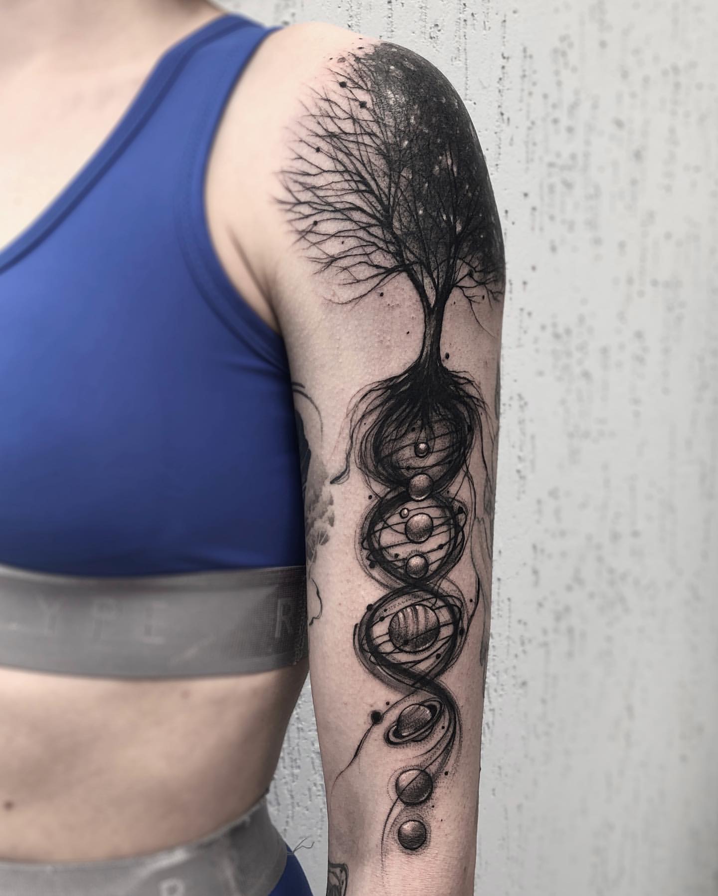 Blackwork Arm Tattoo of Planets