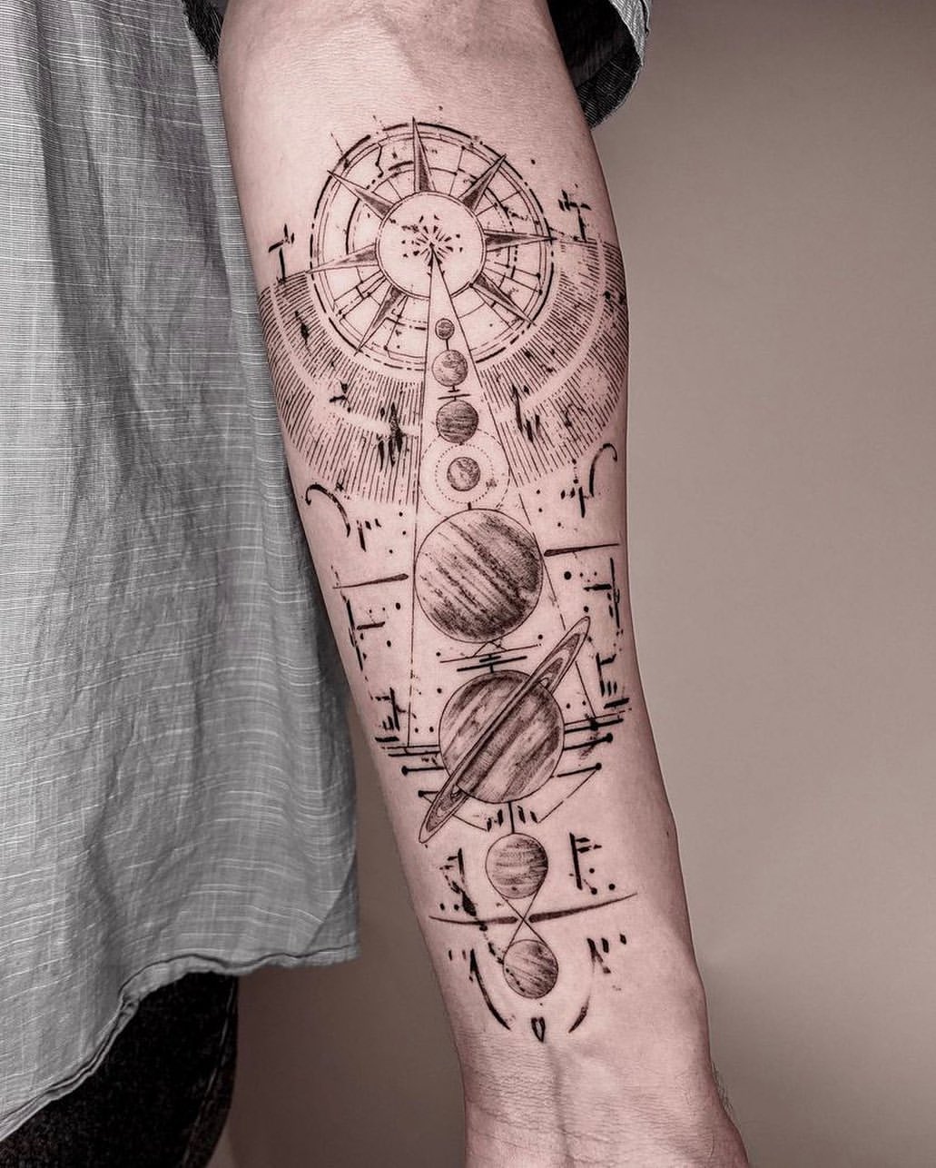 Geometric Black and Gray Forearm Tattoo of Planets