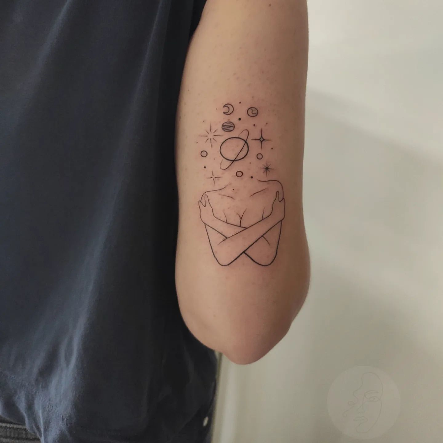 Minimal Linework Tattoo of Woman Hugging Self and Planets