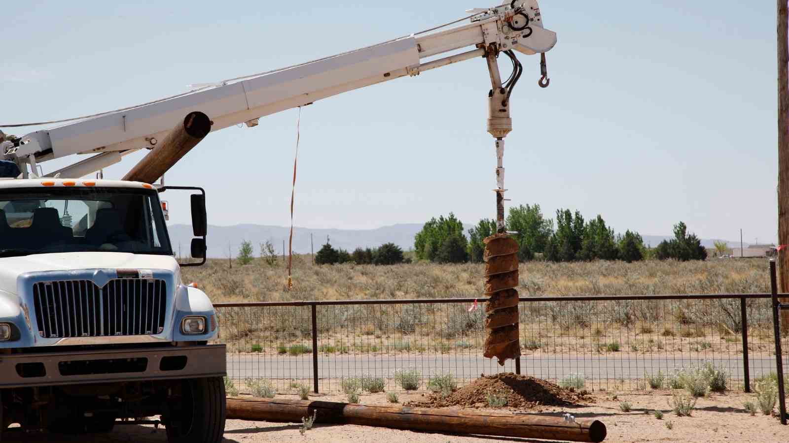 Digging Using an Auger and Erecting a Pole