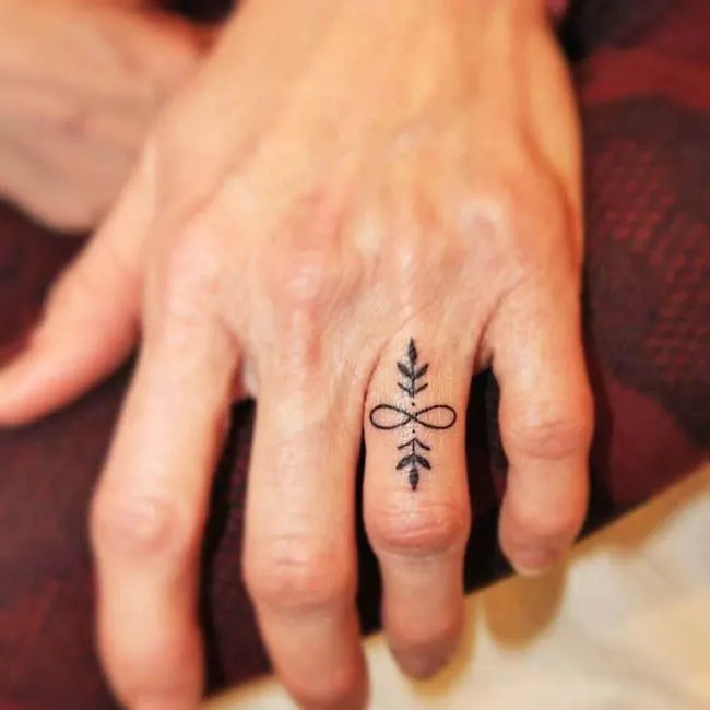 An infinity ring finger tattoo