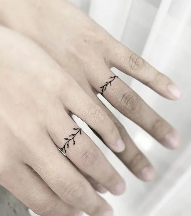 Minimalist matching wedding band tattoos