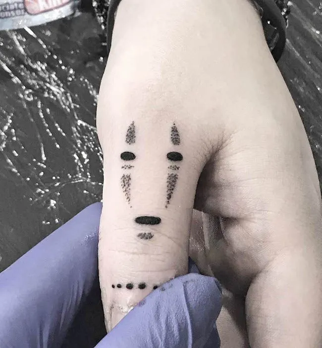 No-Face anime thumb tattoo