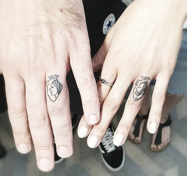 The beating heart couple tattoos