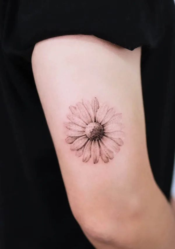 Black and grey daisy tattoo