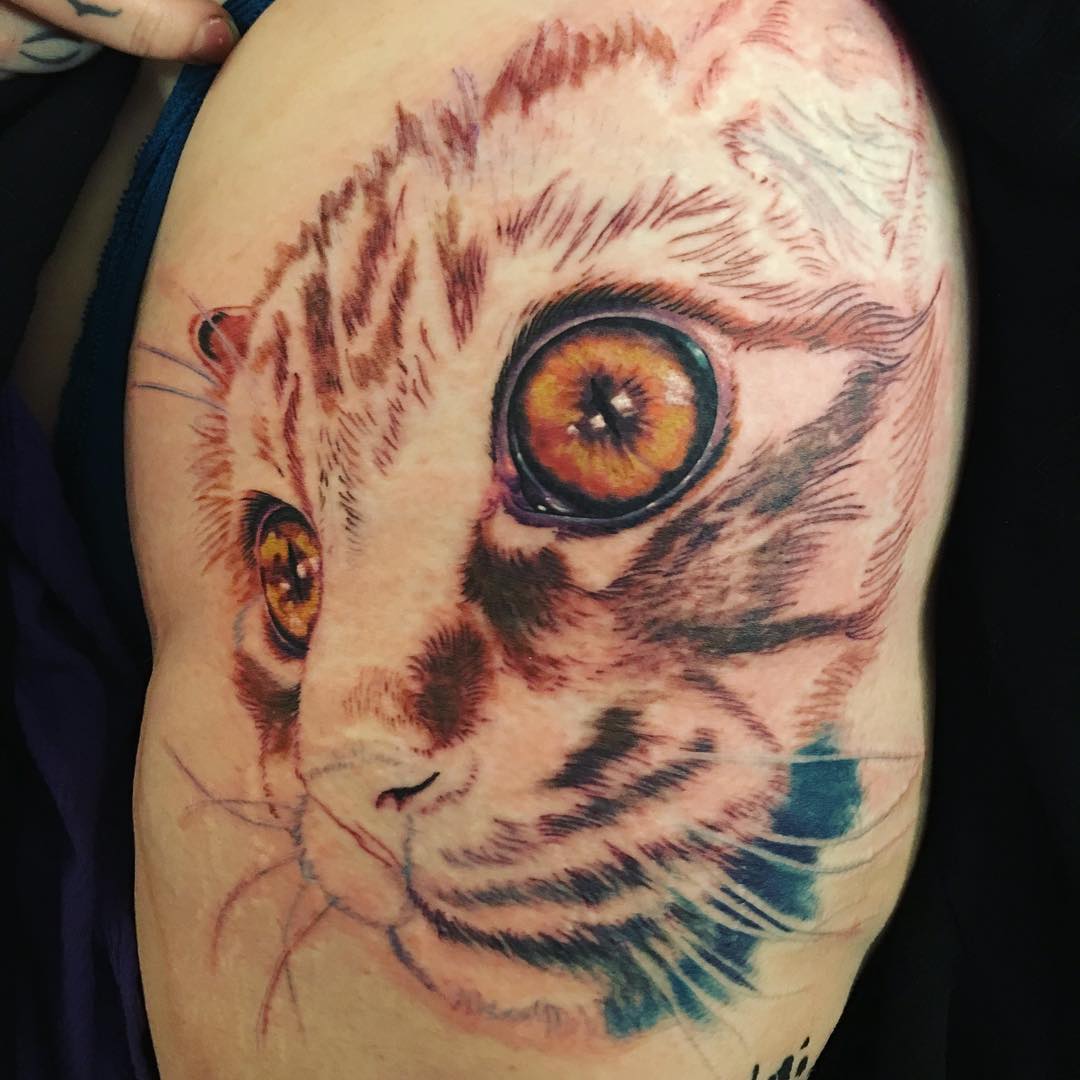 Bold Cat Portrait Hip Tattoo Design