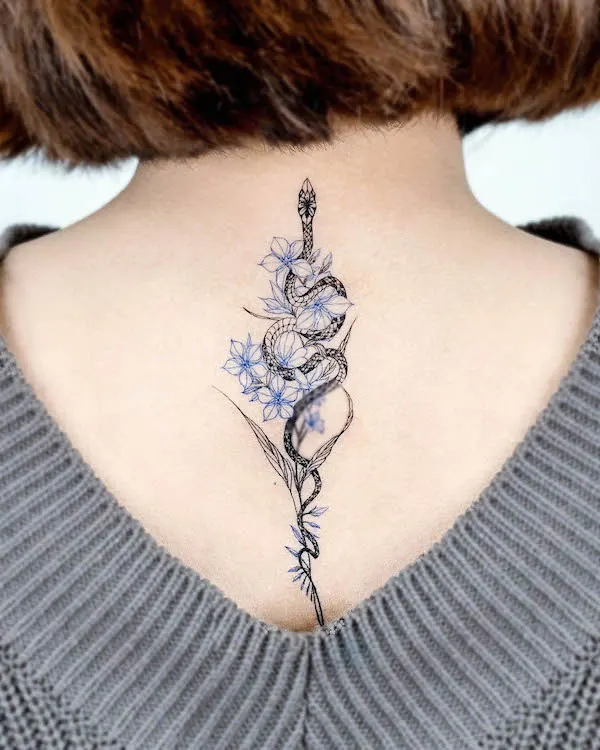 Intricate dragon neck tattoo
