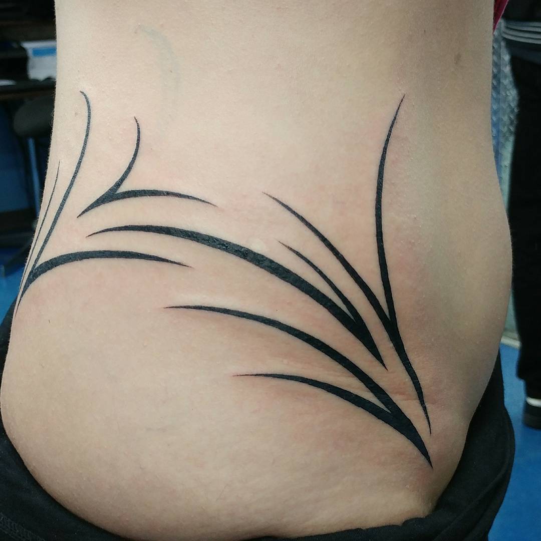 Little Whispy Tribal Hip Tattoo