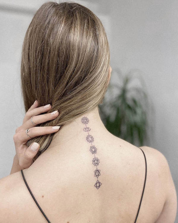 Seven chakras tattoos on the back of neck
