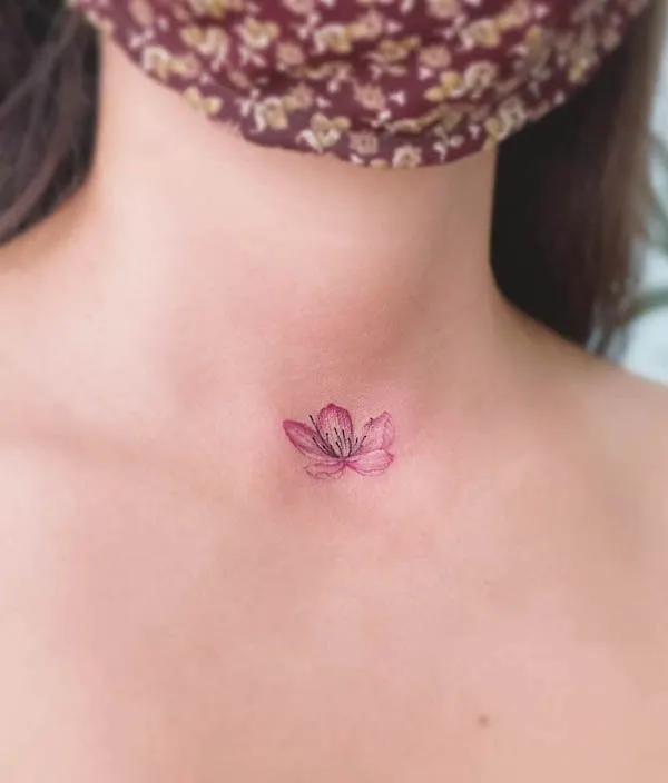 Small cherry blossom neck tattoo
