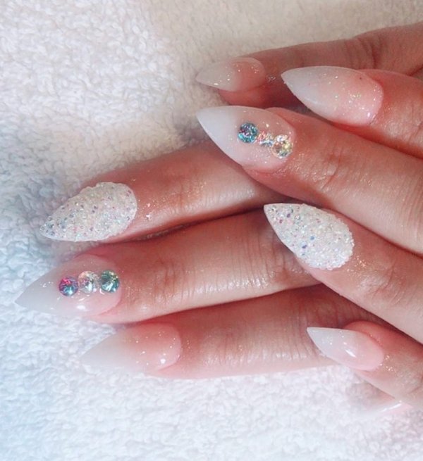 White Stiletto Nails Decorated With Swarovskis Crystals