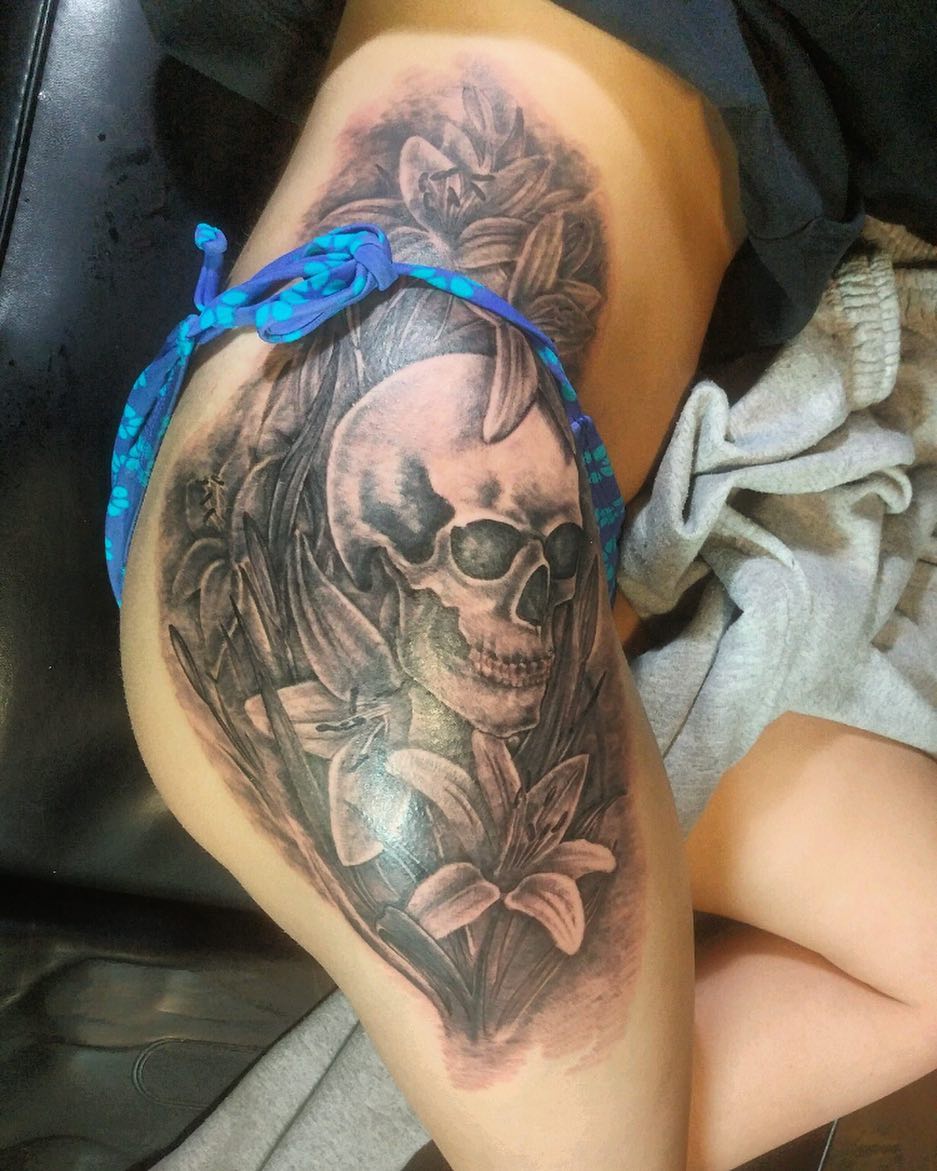 Wonderful Skull With Flower Hip Tattoo