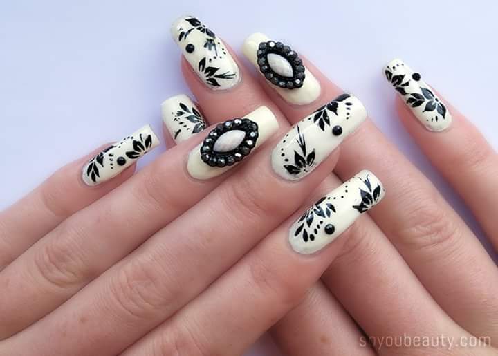 Appealing White Base and Black Flowers Nail Art