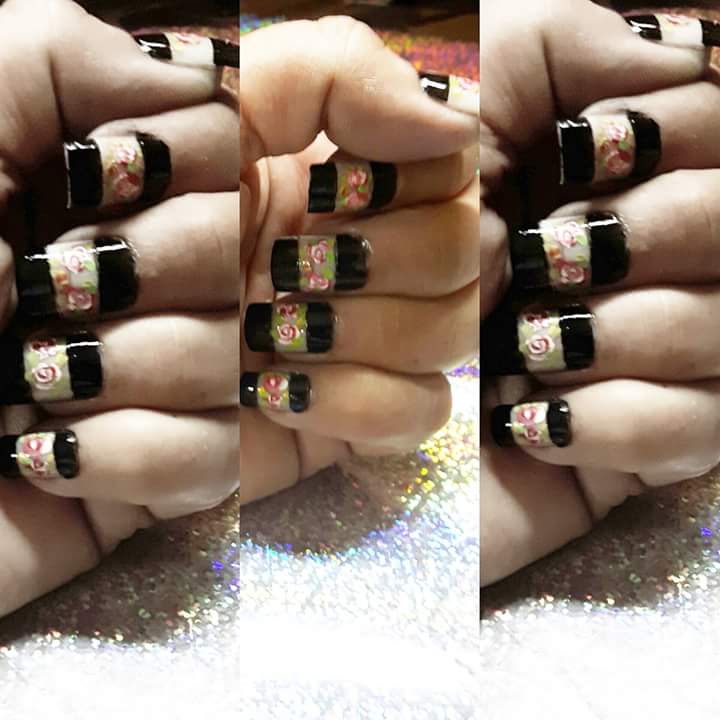 Artistic Black Nail Art with Floral Pattern