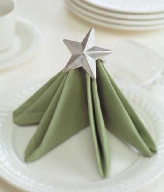 Awesome standing Christmas tree napkin fold with star topper.