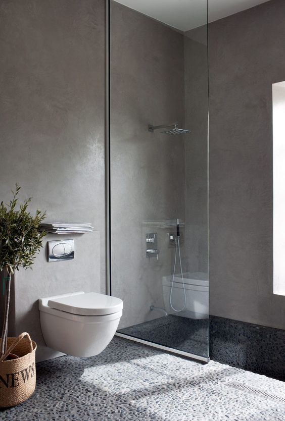 Industrial-Inspired Bathroom with Pebble Floors