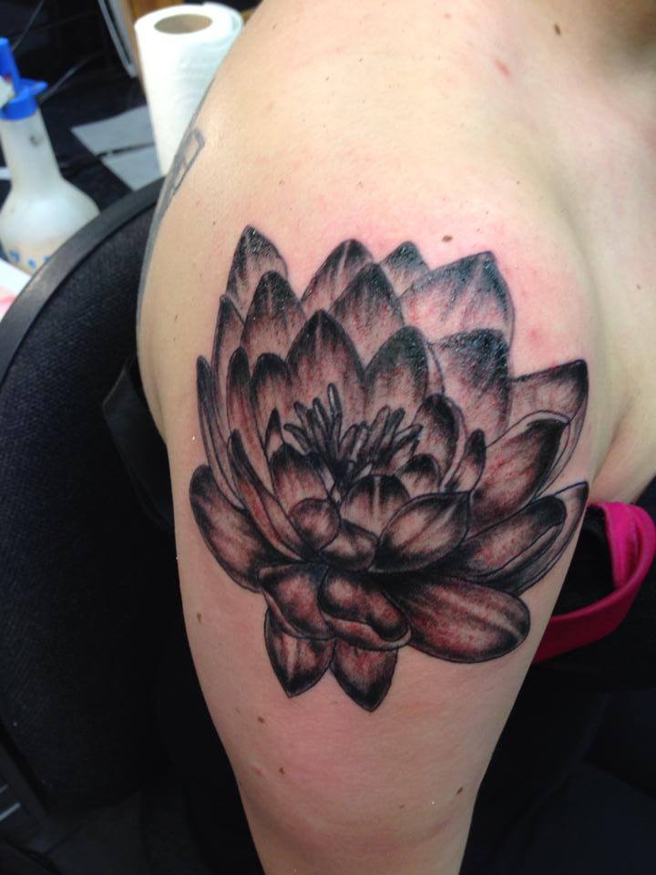 Black and grey lotus flower tattoo