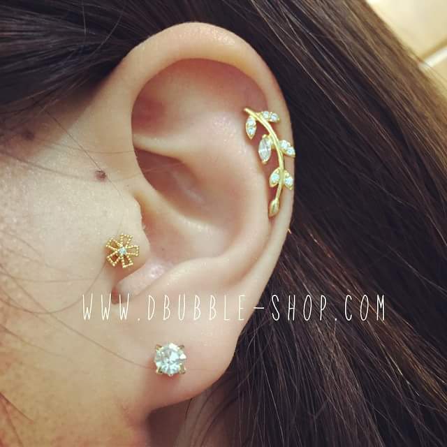 Captivating Gold and Diamond Pinwheel Stud for Pierced Tragus