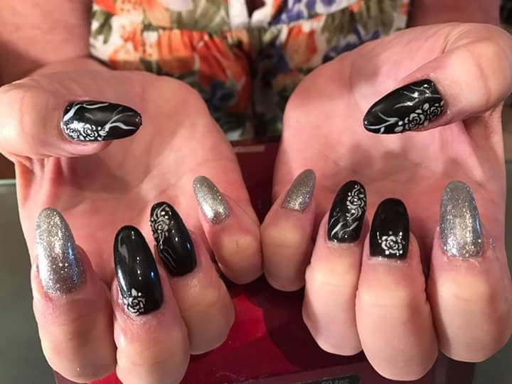 Distinctive Black Nail Art with Glitter Nails