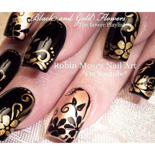 Endearing Black Nail Art with Golden Floral Pattern