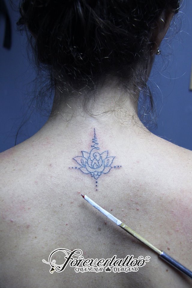 Lotus flower tattoo with bamboo style