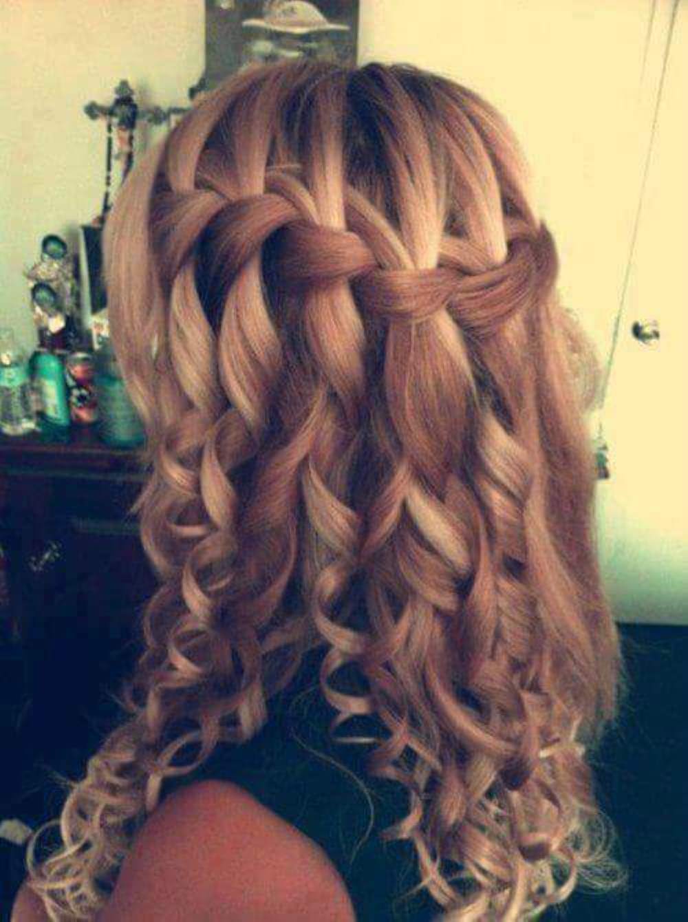 Lovely curled hairstyle in twisted form