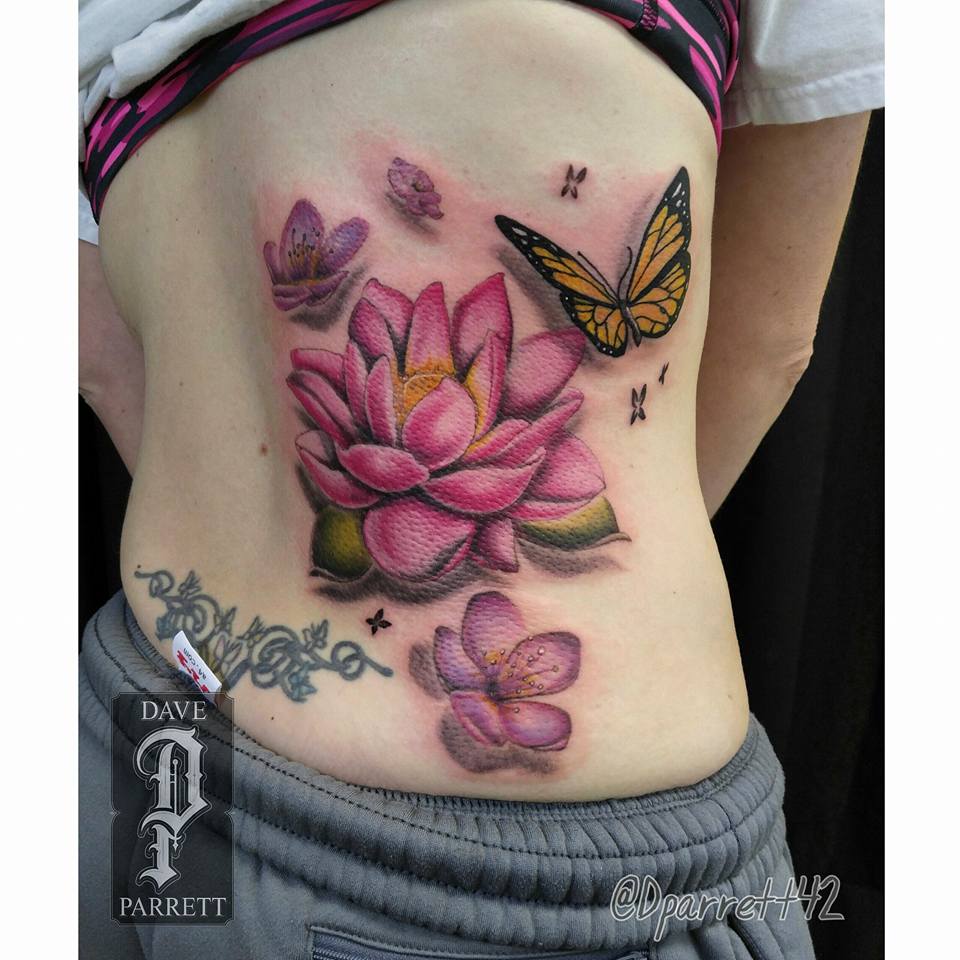 Pretty lotus flower with cherry blossoms butterfly tattoo