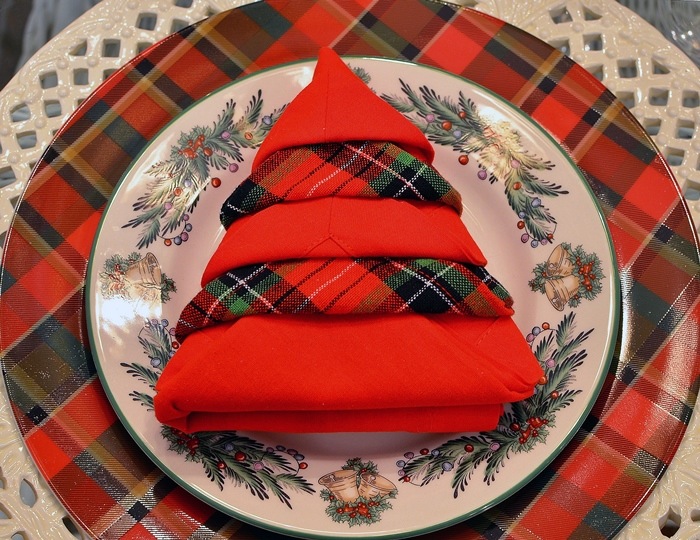 Red plane and plaid Christmas tree napkin folding idea.