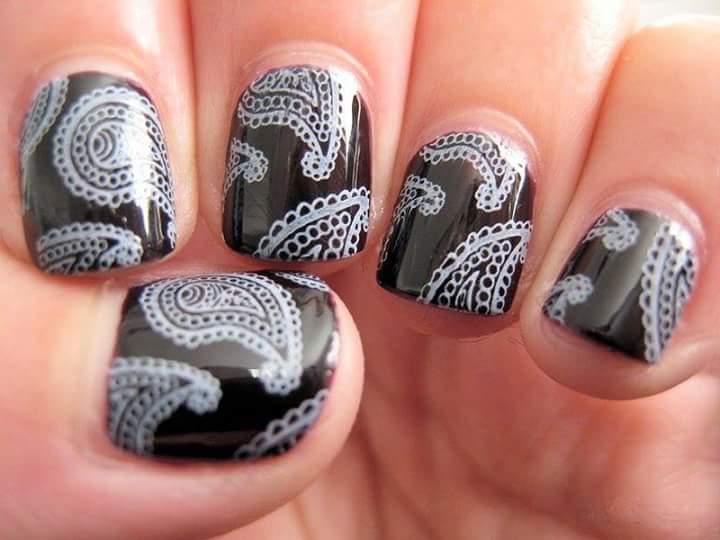 Striking Black Nail Art with Intricate Design