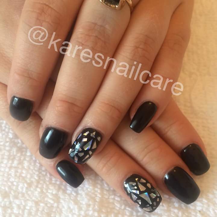 Stunning Black Nail Art with Silver Sparkle on Few Nails