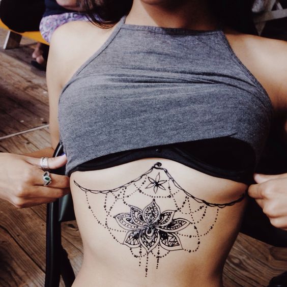 lotus flower rib tattoos